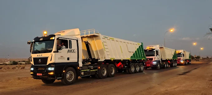 Abu Asmahan Trading trailer convoy at dusk